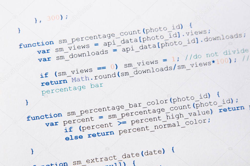 Web developer programming code printed on a piece of paper