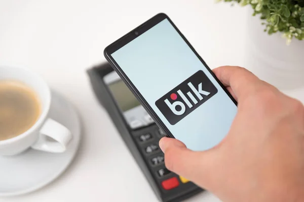 Phone with Blik logo, contactless payment service — Stock Photo, Image