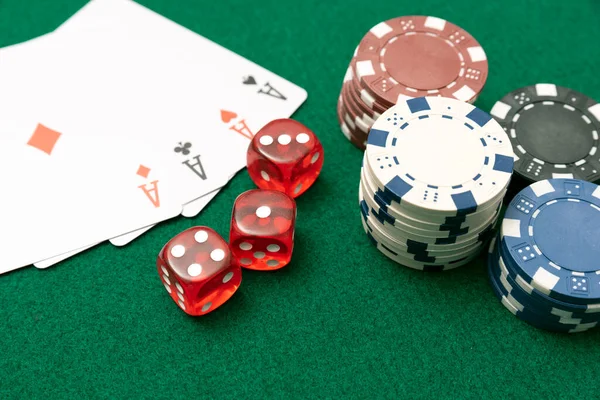 Poker chips, cards on green table — Stock Photo, Image