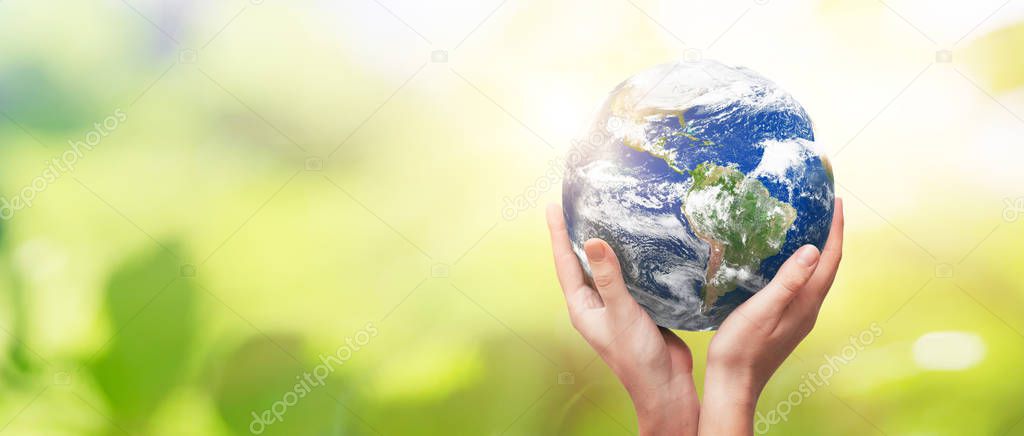 Earth globe in family hands. World environment day