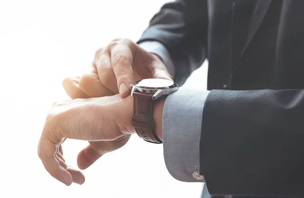 Businessman wears an elegant smart watch — Stock Photo, Image