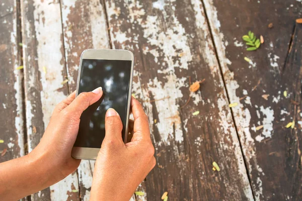 Woman use mobile phone in coffee shop