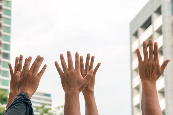 Close up of many human hands raising — Stock Photo, Image