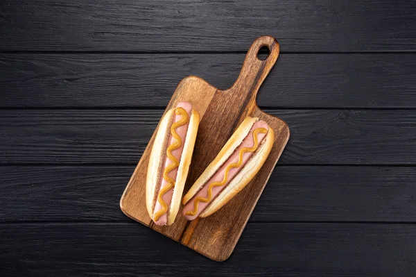 Hot Dogs Mustard Wooden Board Hot Dogs Served Black Table — ストック写真