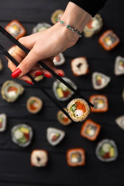 Woman Holds Sushi Chopsticks Young Woman Holding Sushi Chopsticks Isolated — Stock Photo, Image