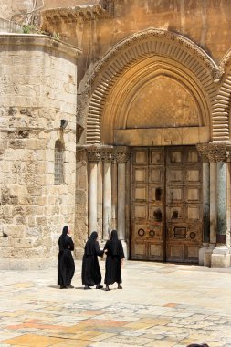 nuns at the entrance to the temple of the Holy Sepulcher, Jerusalem clipart