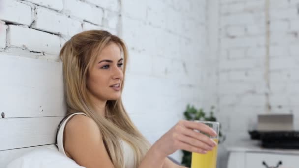 Young Woman Holding Glass Juice Talking — Stock Video