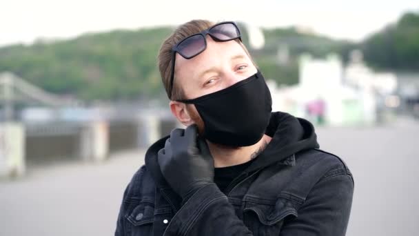 Portrait Man Taking Face Mask Blowing Rubber Glove Showing Middle — Stock Video