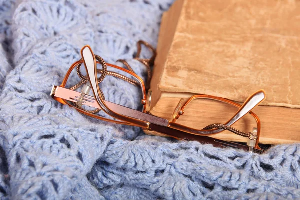 Left glasses and old book — Stock Photo, Image