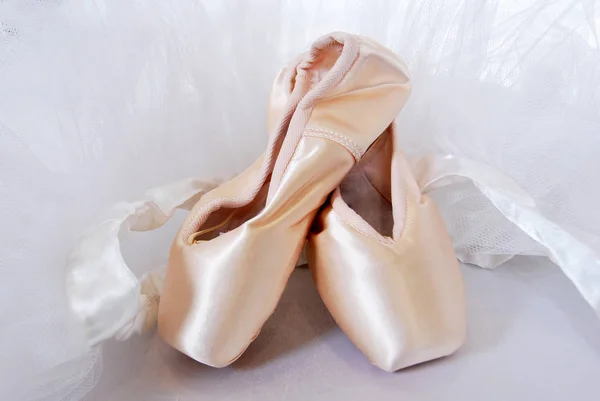 New ballet slippers for classical dance with tulle dress Royalty Free Stock Photos