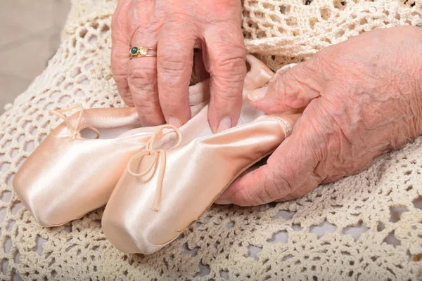 Old classic dance shoes and lilac flowers