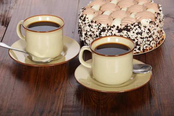 Black coffee in a cup with chocolate cake — Stock Photo, Image