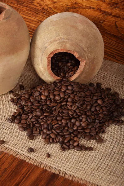 Two clay jugs and coffee grains — Stock Photo, Image