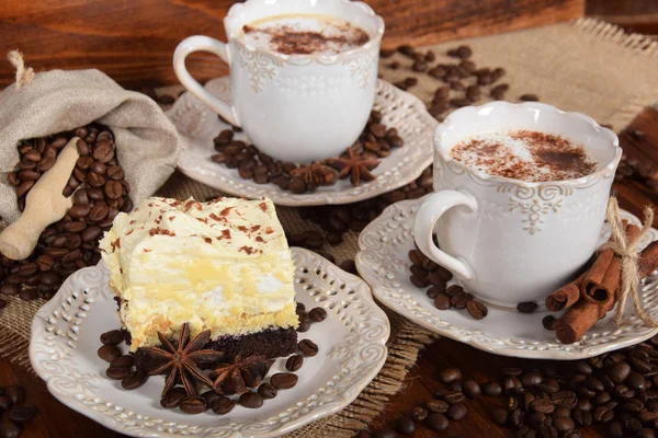 Coffee with chocolate and cacao chocolate cake and a bag of coff — Stock Photo, Image