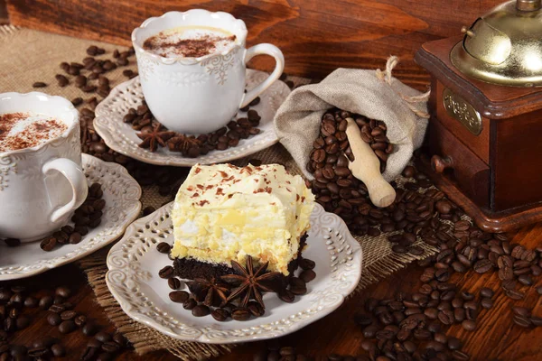 Coffee with chocolate and cacao chocolate cake and a bag of coff — Stock Photo, Image