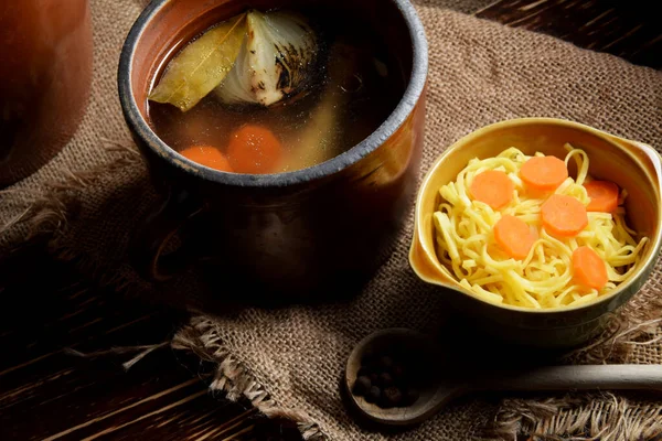 Clay Pot Full Chicken Broth Next Bowl Cooked Pasta — Stock Photo, Image