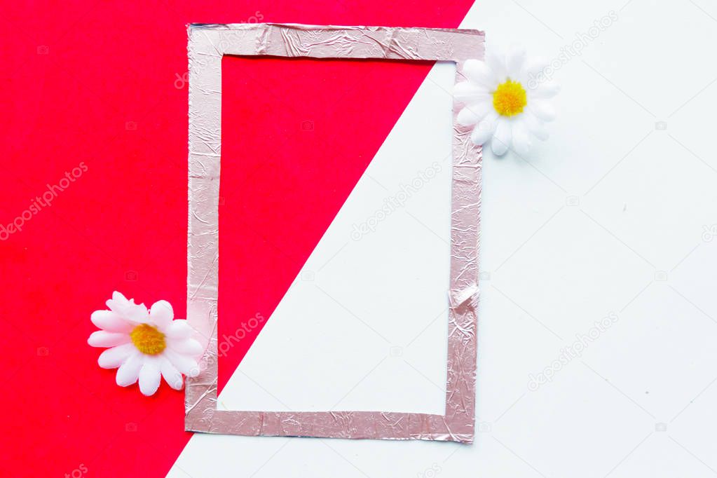 Pink photo frame on geometric red and white background decorative with flowers. Mother's Day, Valentine's Day on Women's Day greeting card