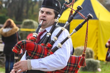 Minsk/ Belarus - October 31 2018: piper plays the bagpipes in the park