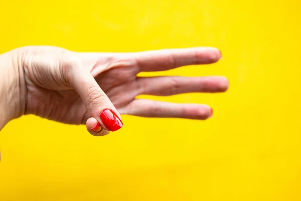 Mano Femenina Mostrando Tres Gestos Sobre Fondo Amarillo Brillante — Foto de Stock