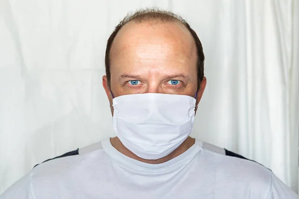 Man in medical mask on white background. Coronavirus concept