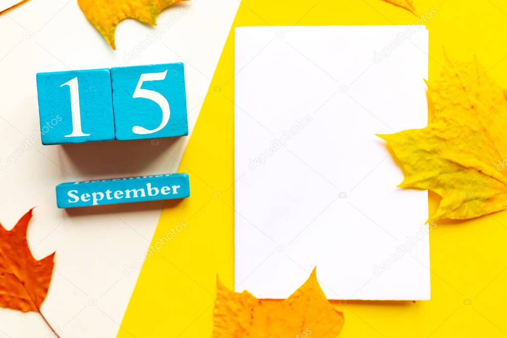 September 15, empty yellow and white geometric background. Wooden handmade calendar