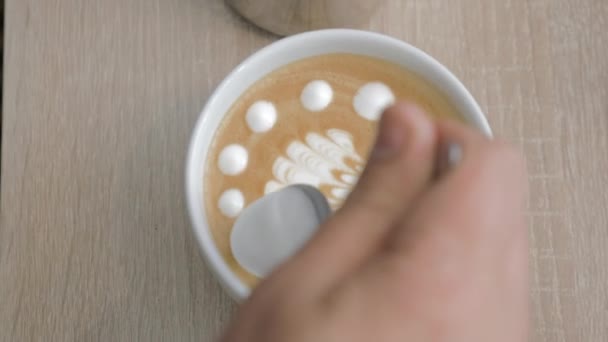 Close-up shot of barista finishing cream picture on latte matcha — Stock Video