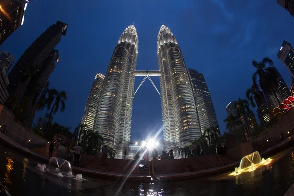 People near Petronas Towers at night, Kuala Lumpur — ストック写真