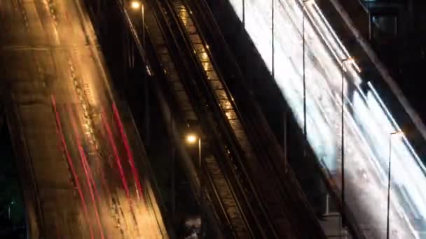 Timelapse of transport trails and empty railway in night city — Stock Video