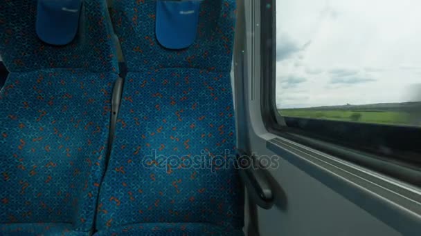 Time lapse shot inside of modern empty train wagon with table, seat places and windows, Viena, Áustria — Vídeo de Stock