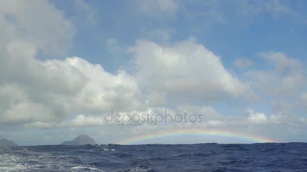 View of rainbow against blue sky with clouds in Indian Ocean, Mauritius Island — Stock Video
