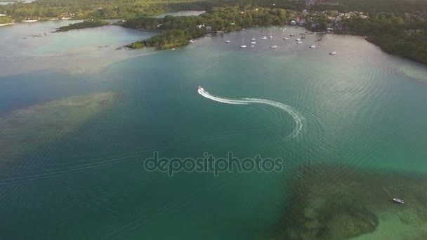 Flying over motor boat sailing in bay, Mauritius Island — Stock Video