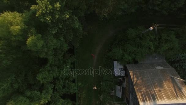 Child catching descending drone — Stock Video