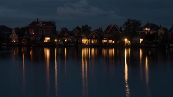 Timelapse of night coming to waterside village in Netherlands — Stock Video