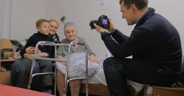 Taking photos with elderly grandma — Stock Video