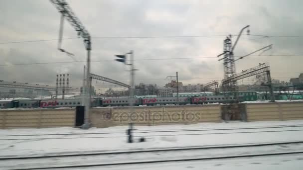Passing by the railway tracks with trains, Russia — Stock Video