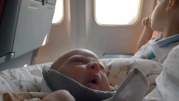 Sleepy baby in the airplane — Stock Video