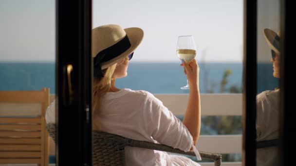 Woman relaxing in solitude. She drinking wine and enjoying sea view Video Clip
