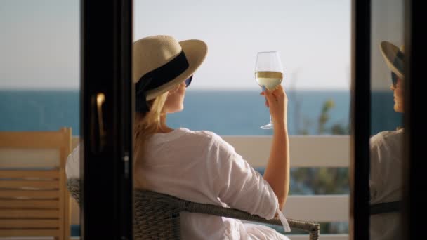 Woman relaxing in solitude. She drinking wine and enjoying sea view — Stock Video