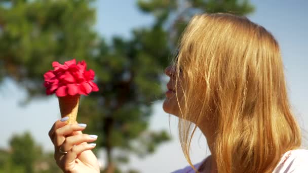 Young woman with waffle cone  bouquet  outdoor — Stock Video