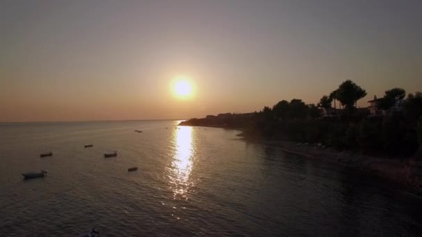 Aerial scene of shore and sea with boats at sunset, Greece — Stock Video