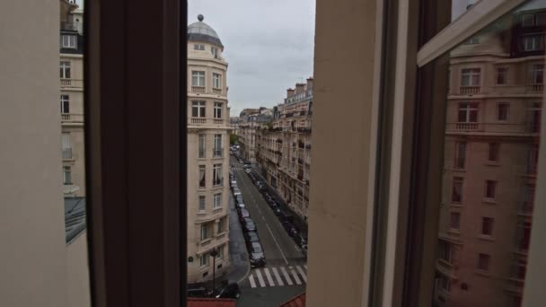 Timelapse of traffic in Parisian street, view through window — Stock Video