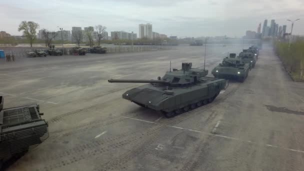 Aerial shot of tanks in columns setting off from military base, Russia — Stock Video