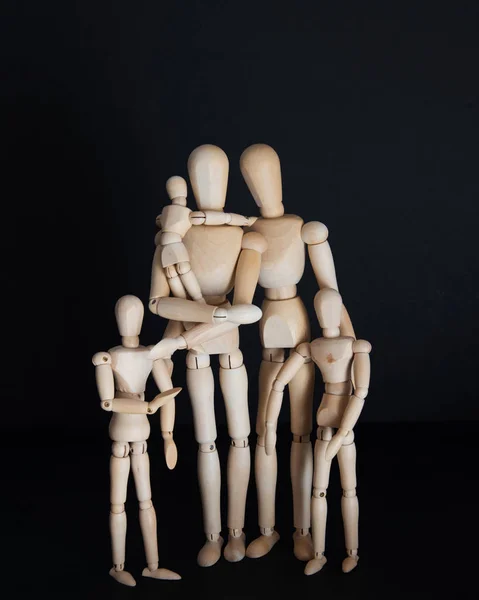 Photos wooden dolls, happy family with children on black background — Stock Photo, Image