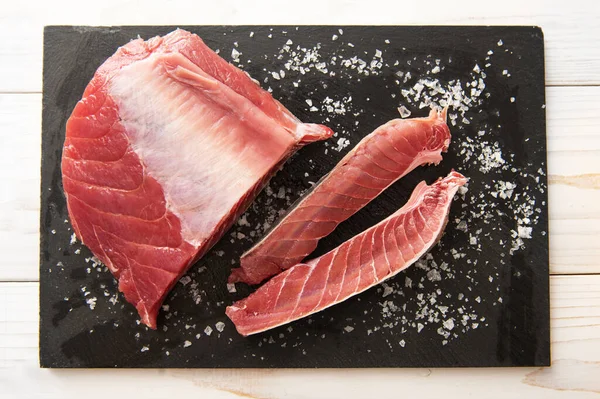 Fresh large piece of tuna with salt — Stock Photo, Image