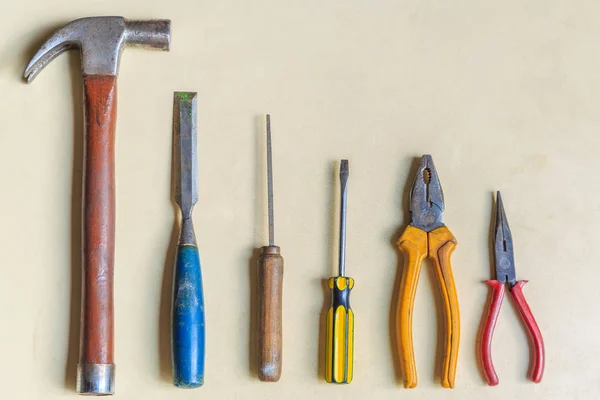Construction tools on wooden background.