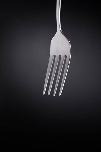 Fork in black background