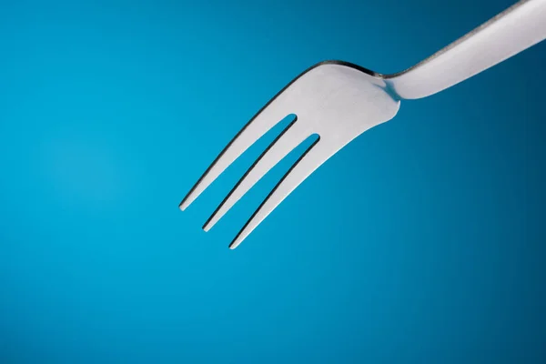 Empty Fork in Blue Background — Stock Photo, Image