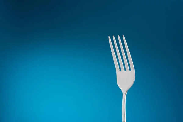 Empty Fork in Blue Background — Stock Photo, Image