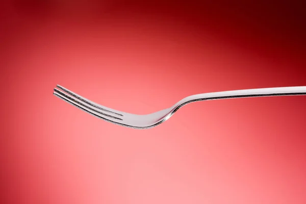 Fork in red background, Horizontal — Stock Photo, Image