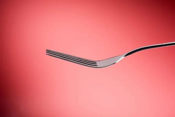 Fork in red background, Horizontal — Stock Photo, Image